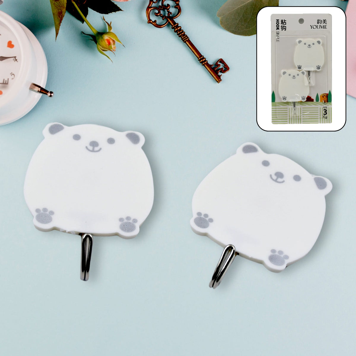 A pair of strong self-adhesive hooks for wall mounting in a modern home.