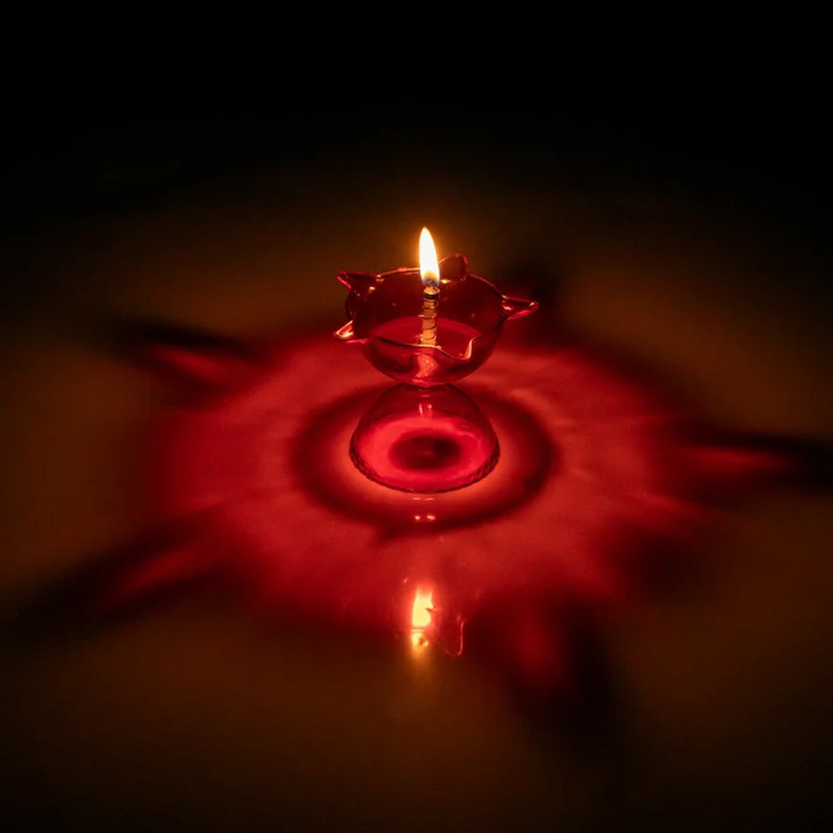 Overhead view of the complete 4-piece Reflection Diya Set, ready for festive use.