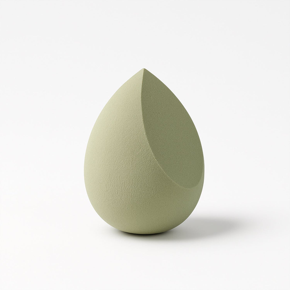 Demonstrating the soft, flexible texture and elasticity of the BeautyBare makeup sponge.