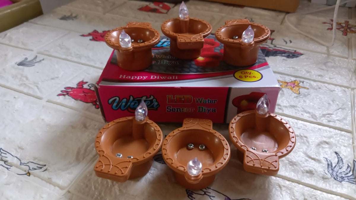 A packaged set of six innovative water sensor diyas, ideal for Diwali gifting.