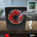 Compact portable desk fan on a wooden table, powered by USB for versatile use.