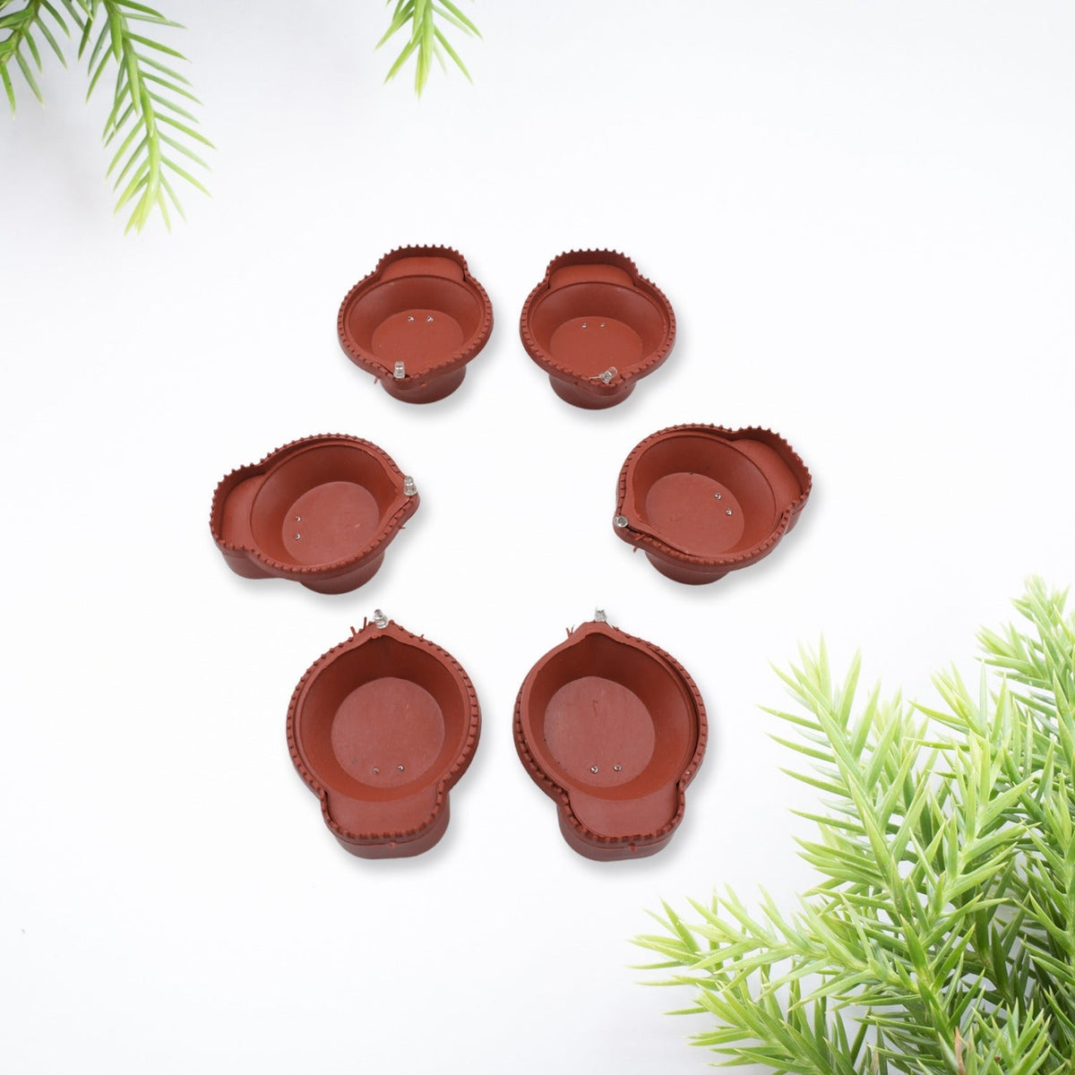 Water Sensor Diyas glowing brightly in a traditional setting for Diwali decoration.