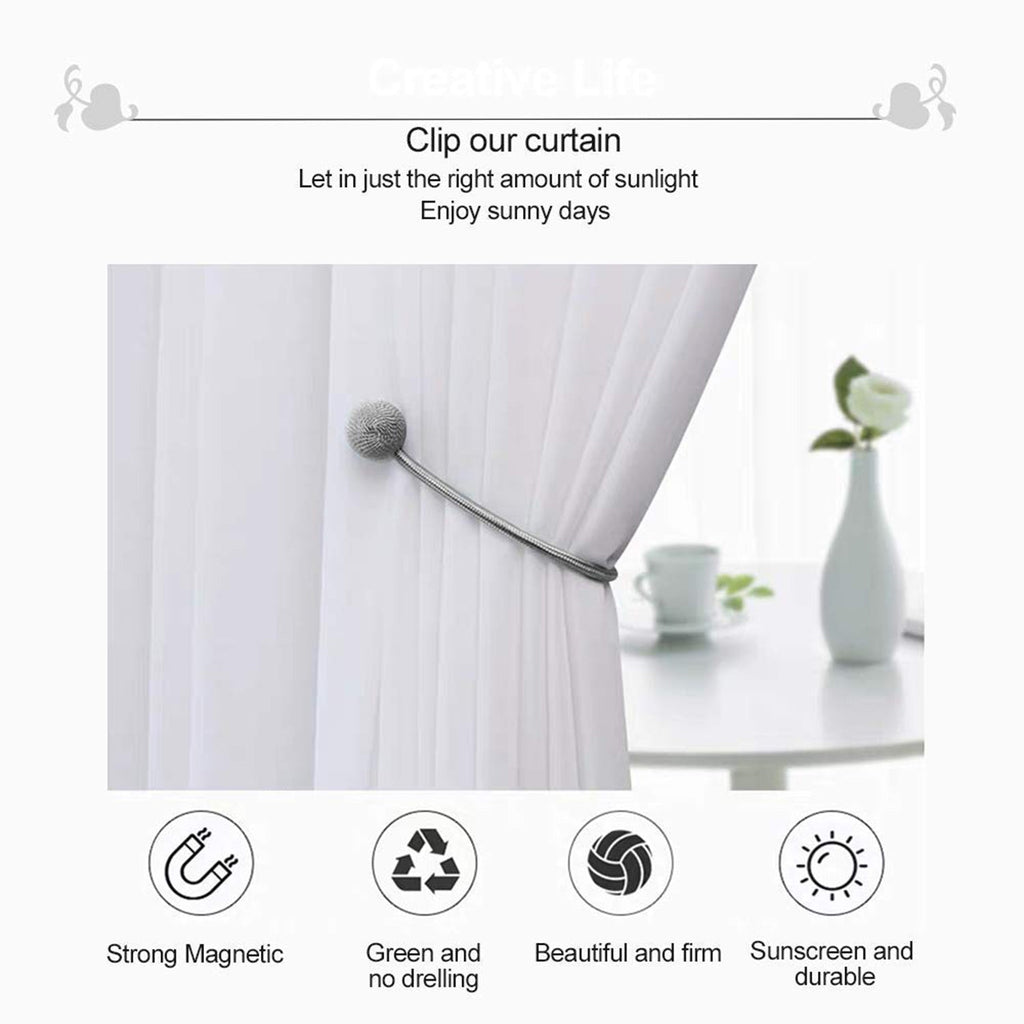 Magnetic curtain holdback with its two magnetic balls snapped together.